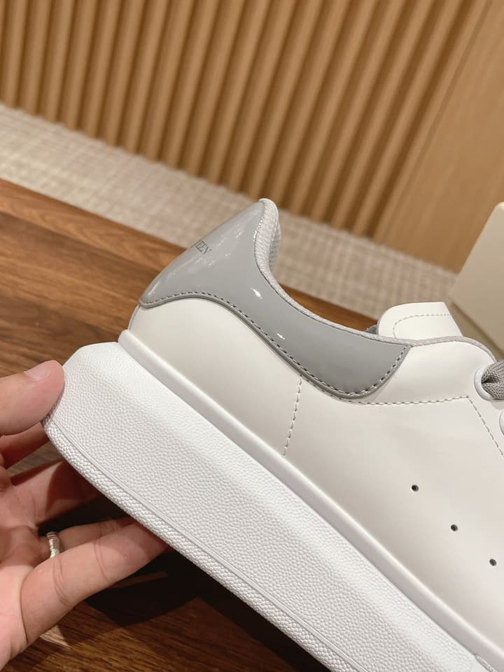 Alexander McQueen Classic Versatile White Sneakers in White With Black Laces & Heel