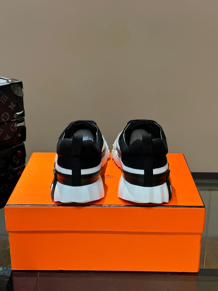 Hermès Bouncing Calfskin Mesh Sneakers in Black With White Stripe
