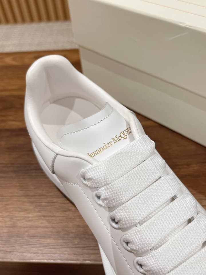 Alexander McQueen Classic Versatile White Sneakers in White With Black Laces & Heel