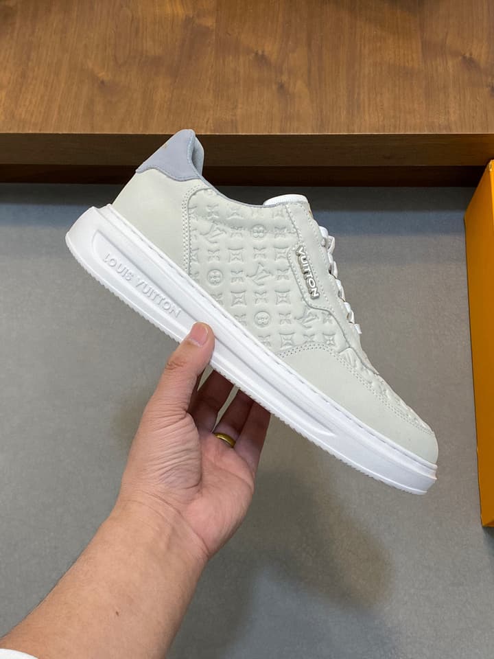 Louis Vuitton Embossed Calfskin Sneakers in Black