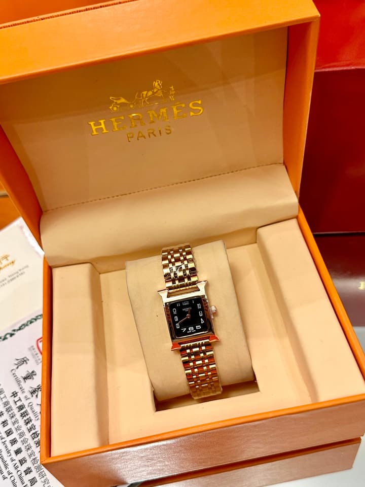 Hermès Small Square Luxury Watch in Dark Dial Patterned Gold Bracelet