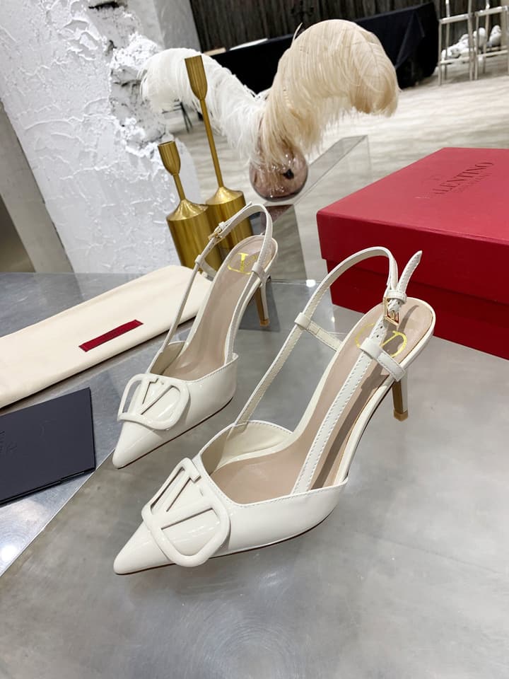 Valentino VLogo Pointed-Toe Patent Leather Pumps in Black Patent