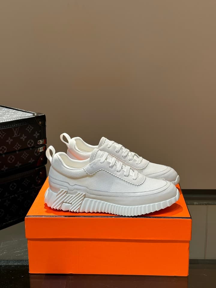 Hermès Bouncing Calfskin Mesh Sneakers in Black With White Stripe