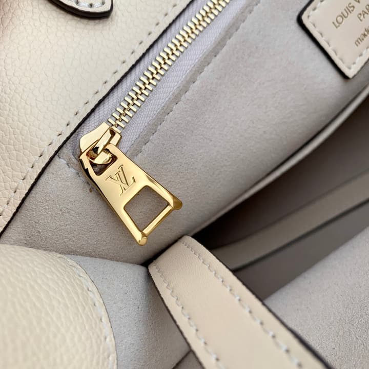 Louis Vuitton OnTheGo Small Tote Bag in Cream Empreinte With Monogram Sides