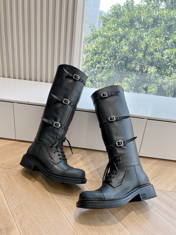 Miu Miu Distressed Biker Knee-High Boots – Autumn/Winter Runway Edition in Distressed Black Moto Boots