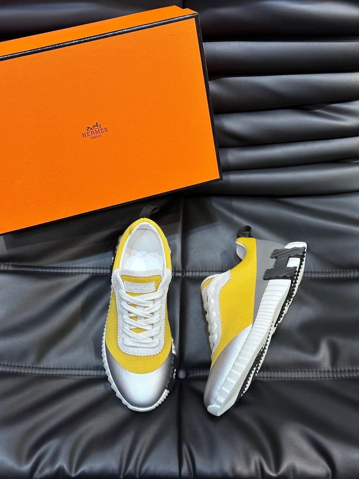 Hermès Bouncing Calfskin Mesh Sneakers in Black With White Stripe