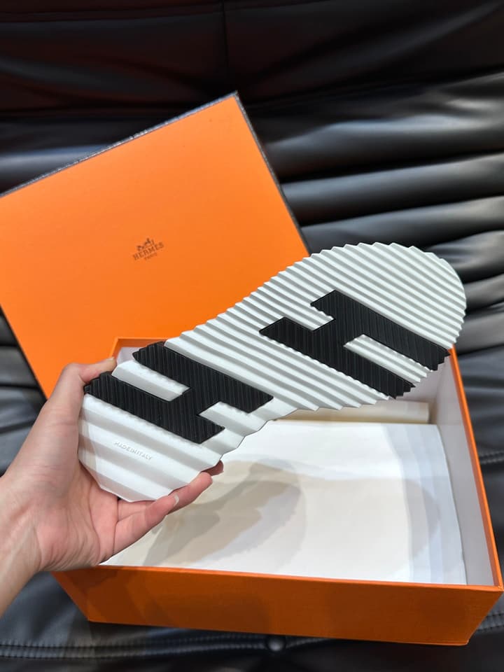 Hermès Bouncing Calfskin Mesh Sneakers in Black With White Stripe