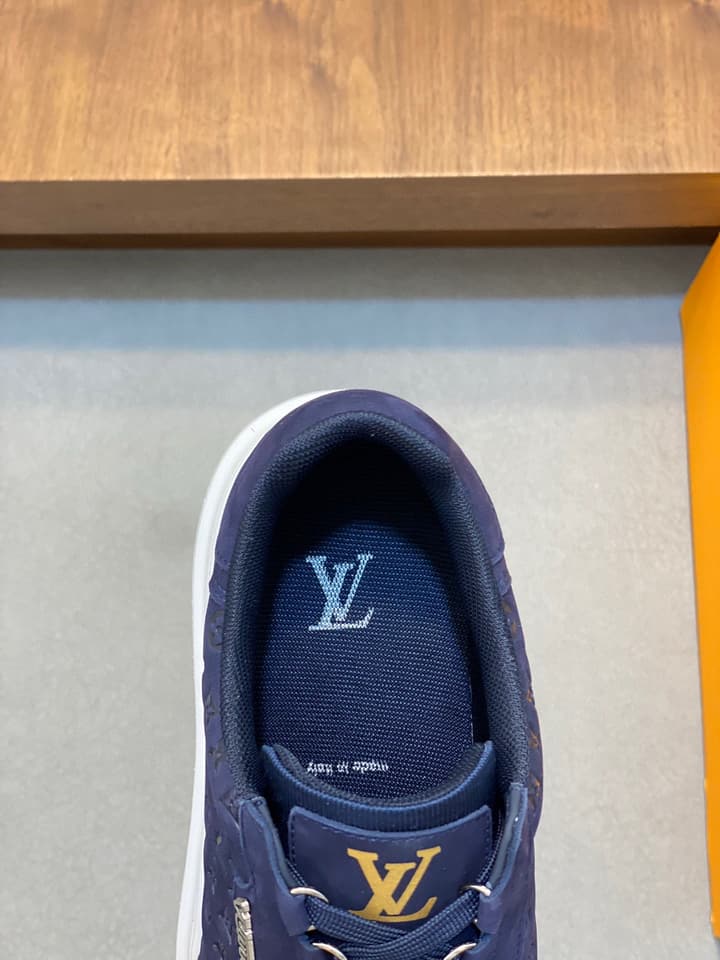 Louis Vuitton Embossed Calfskin Sneakers in Black