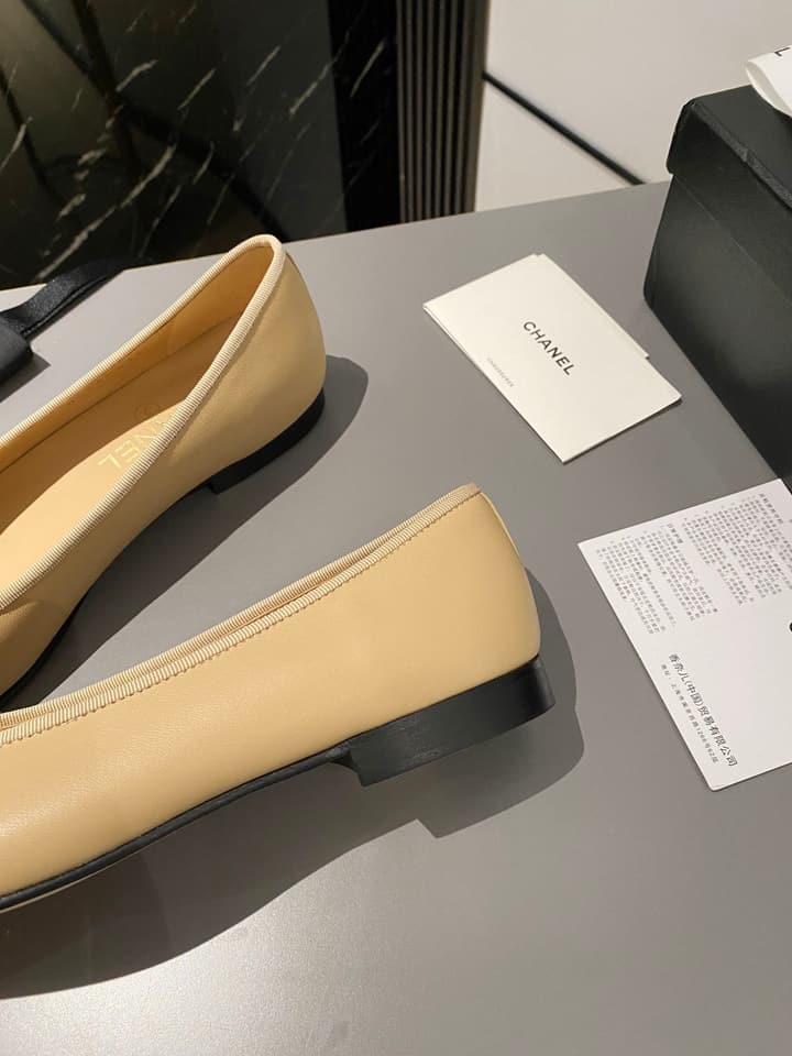 Chanel Classic Ballet Flats in Tan With Black Cap Toe