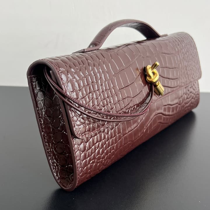 Bottega Veneta Crocodile Embossed Intrecciato Clutch in Gold