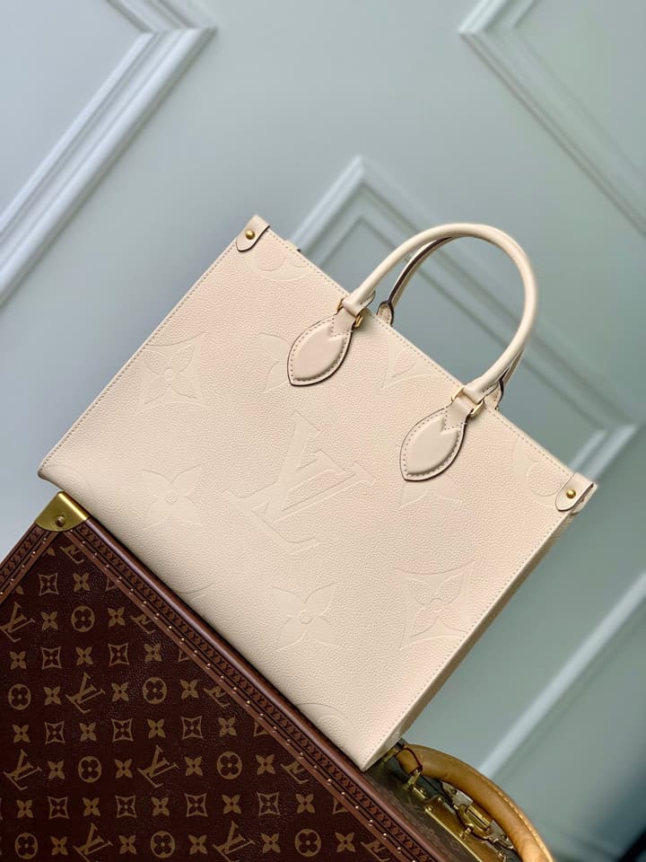 Louis Vuitton OnTheGo Medium Monogram Empreinte Tote in Cream Monogram Empreinte