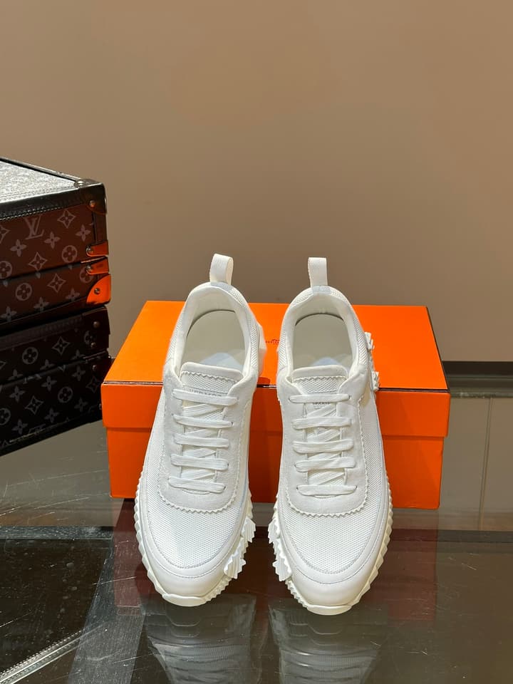 Hermès Bouncing Calfskin Mesh Sneakers in Black With White Stripe