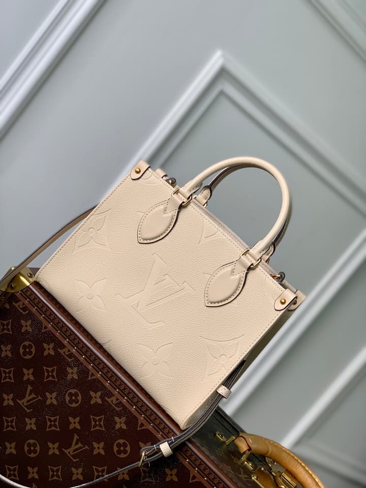 Louis Vuitton OnTheGo Small Tote Bag in Cream Empreinte With Monogram Sides