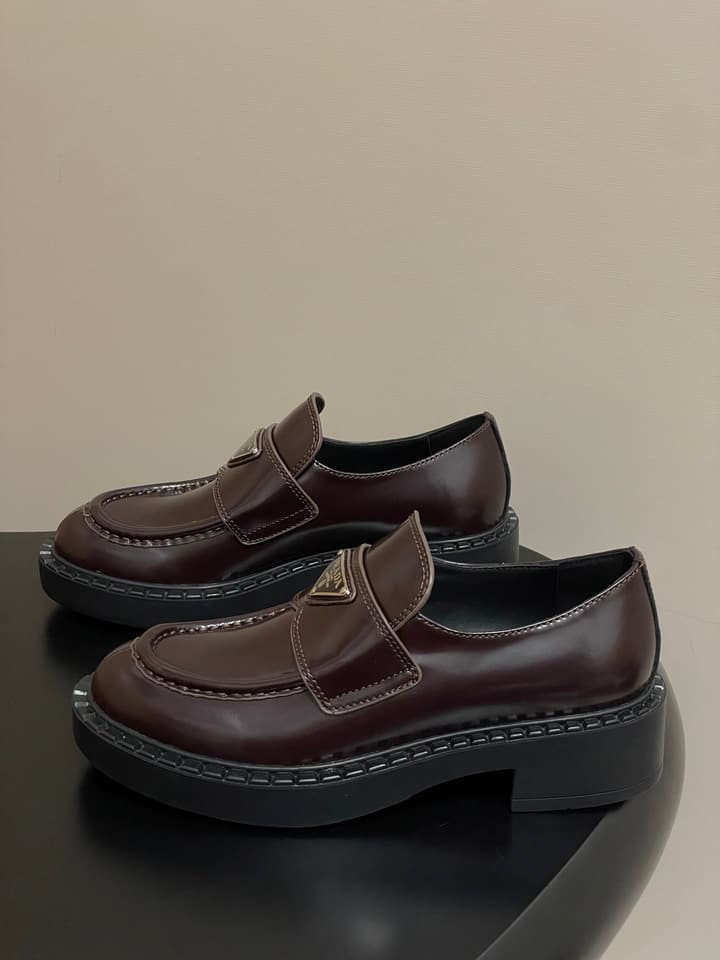 Prada Triangle Logo Platform Loafers in Black