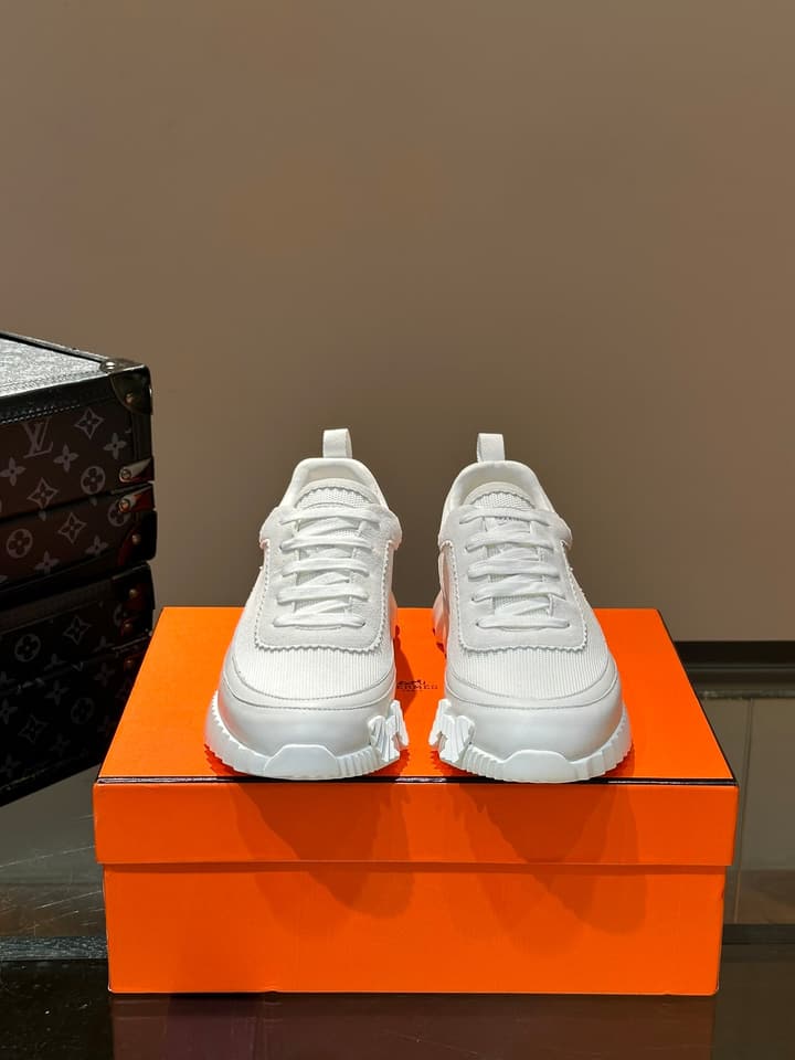 Hermès Bouncing Calfskin Mesh Sneakers in Black With White Stripe