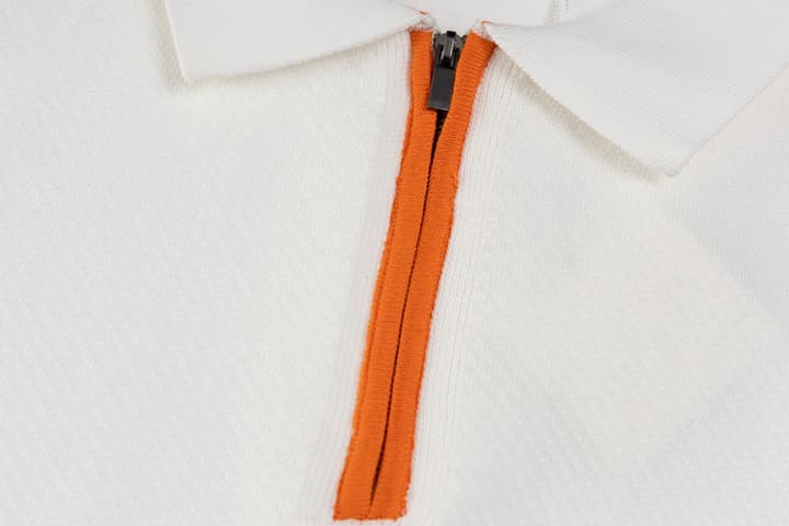 Hermès Retro Knitted Polo Shirt – SS24 in Black Polo With Orange Placket