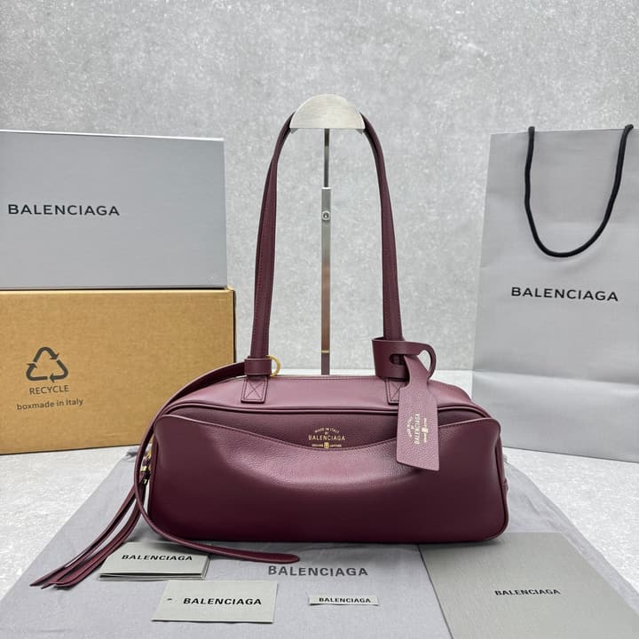 Balenciaga Carrie Leather Bowling Bag – Small in Burgundy