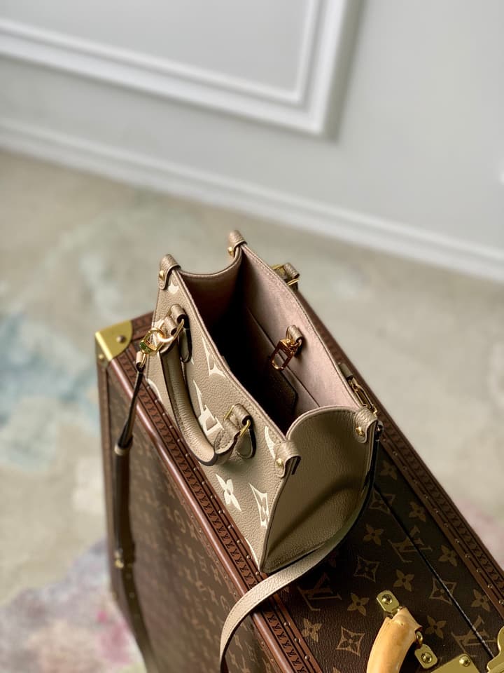 Louis Vuitton OnTheGo BB Monogram Empreinte Handbag in Beige And Cream Monogram