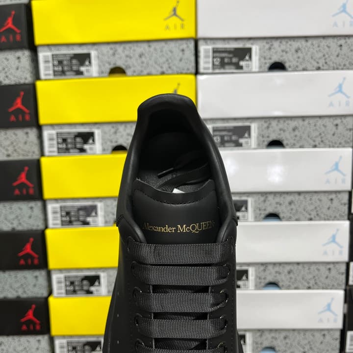 Alexander McQueen Oversized Low-Top Sneakers in All Black With White Sole