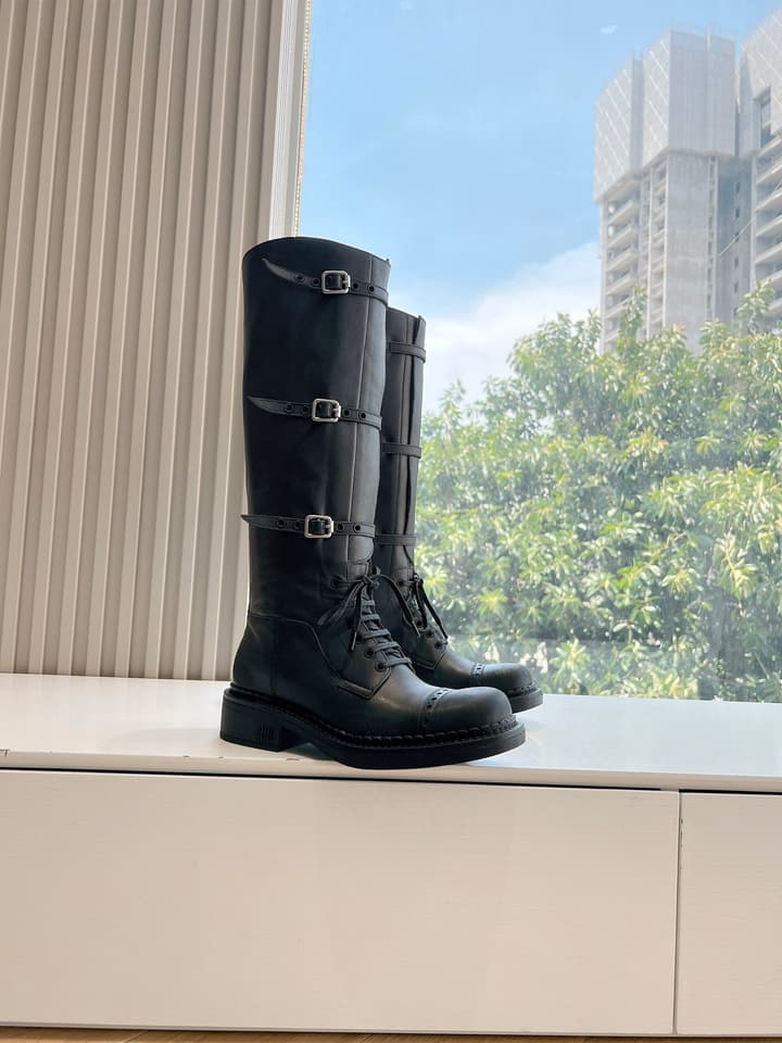 Miu Miu Distressed Biker Knee-High Boots – Autumn/Winter Runway Edition in Distressed Black Moto Boots