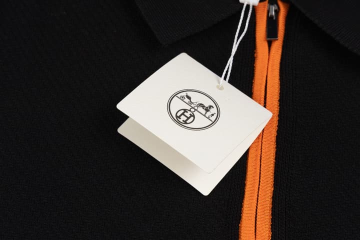 Hermès Retro Knitted Polo Shirt – SS24 in Black Polo With Orange Placket