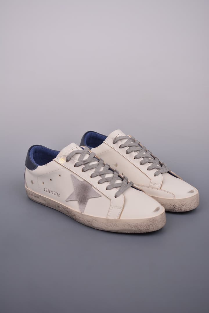 Golden Goose Super Star Distressed Sneakers – 2023 Collection in White With Navy Heel