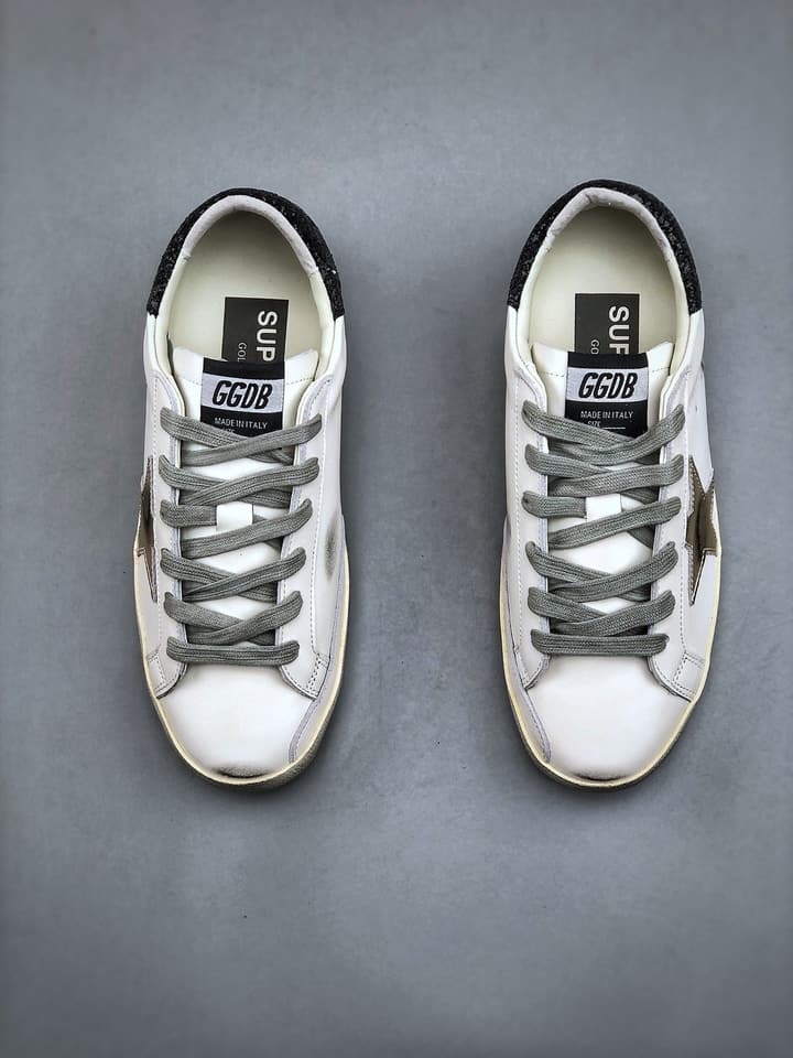 Golden Goose Distressed Sneakers in Gold