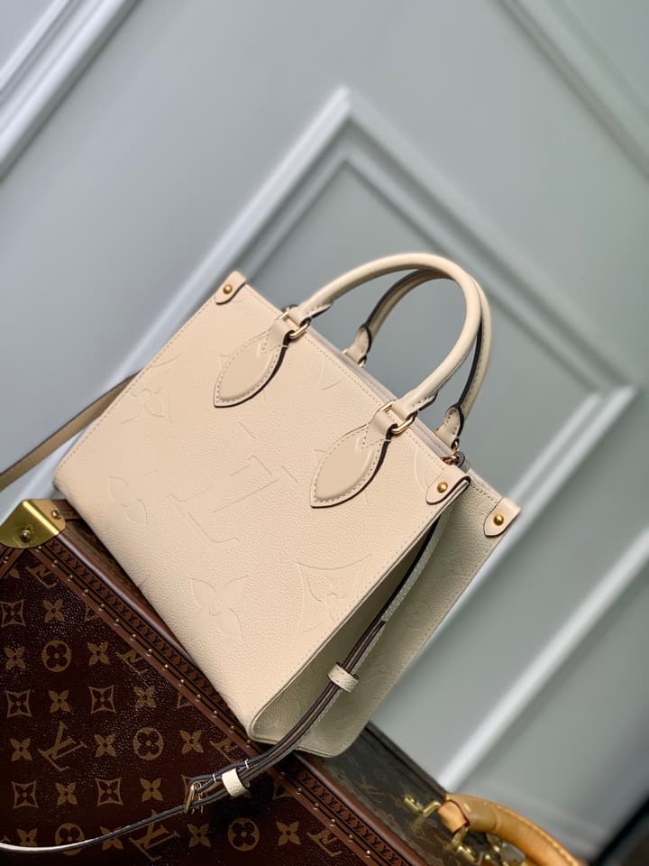 Louis Vuitton OnTheGo Small Tote Bag in Cream Empreinte With Monogram Sides