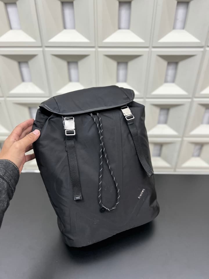 RIMOWA Signature Series Flap Drawstring Backpack in Classic Black