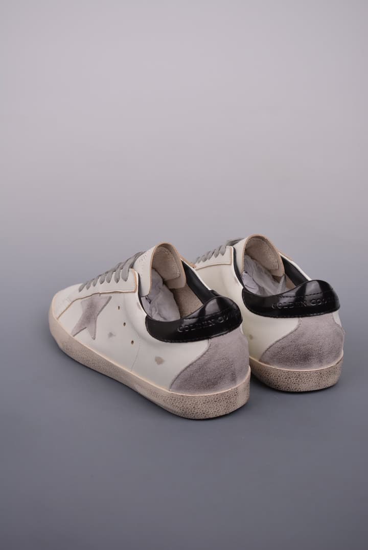 Golden Goose Super Star Distressed Sneakers – 2023 Collection in White With Navy Heel
