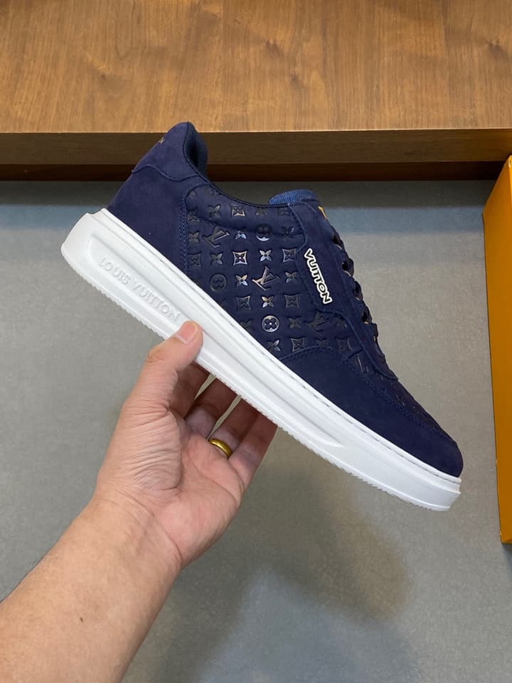 Louis Vuitton Embossed Calfskin Sneakers in Black