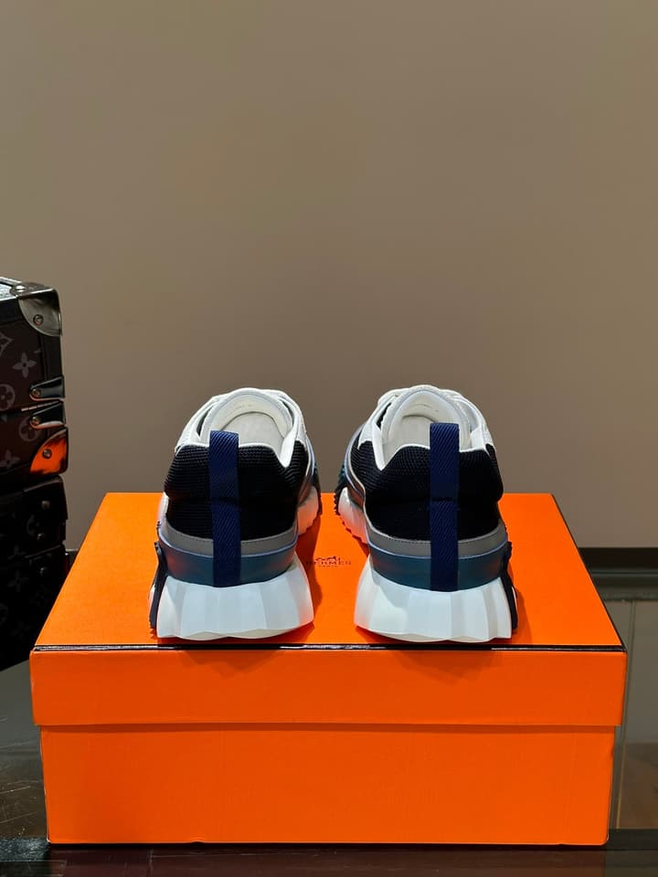 Hermès Bouncing Calfskin Mesh Sneakers in Black With White Stripe