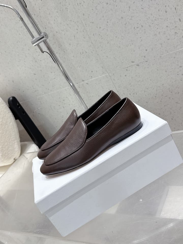 The Row Tassel Loafers in Black Suede