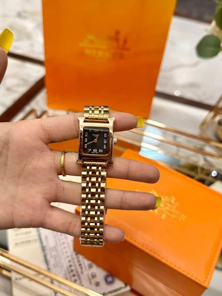 Hermès Small Square Luxury Watch in Dark Dial Patterned Gold Bracelet