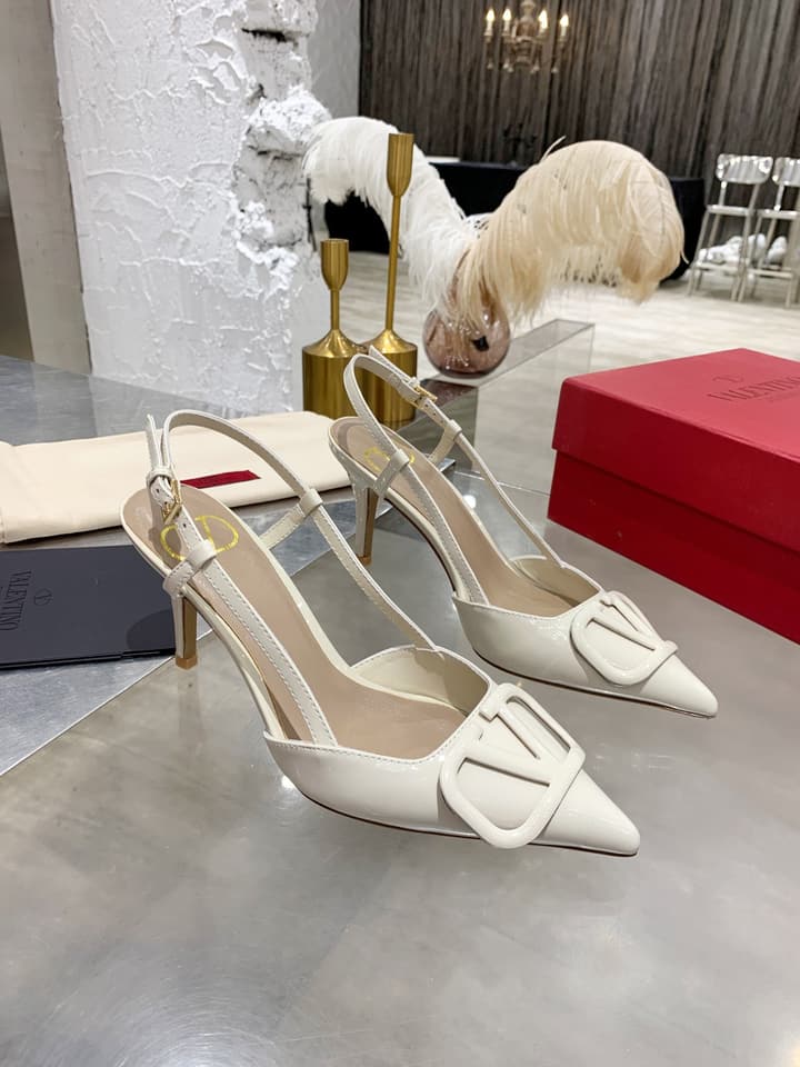Valentino VLogo Pointed-Toe Patent Leather Pumps in Black Patent