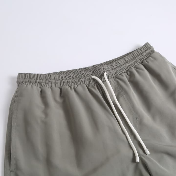 Brunello Cucinelli Embroidered Swim Trunks in Navy Blue