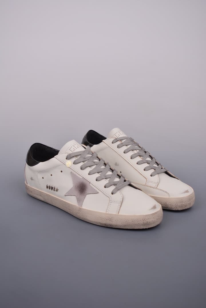 Golden Goose Super Star Distressed Sneakers – 2023 Collection in White With Navy Heel