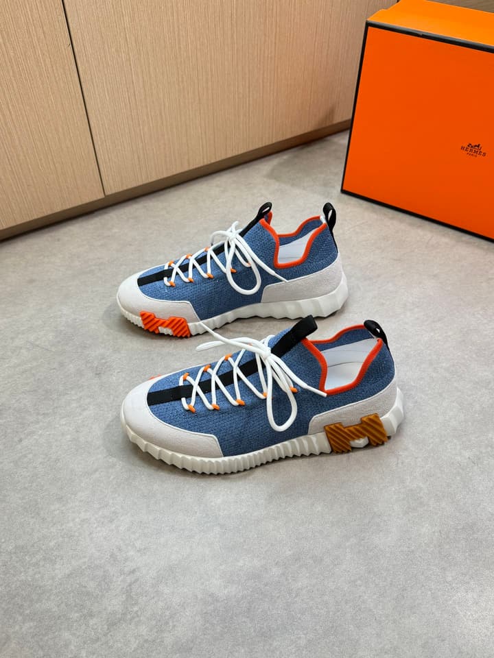 Hermès Casual Sports Sneakers in Black With White Laces And Orange Sole