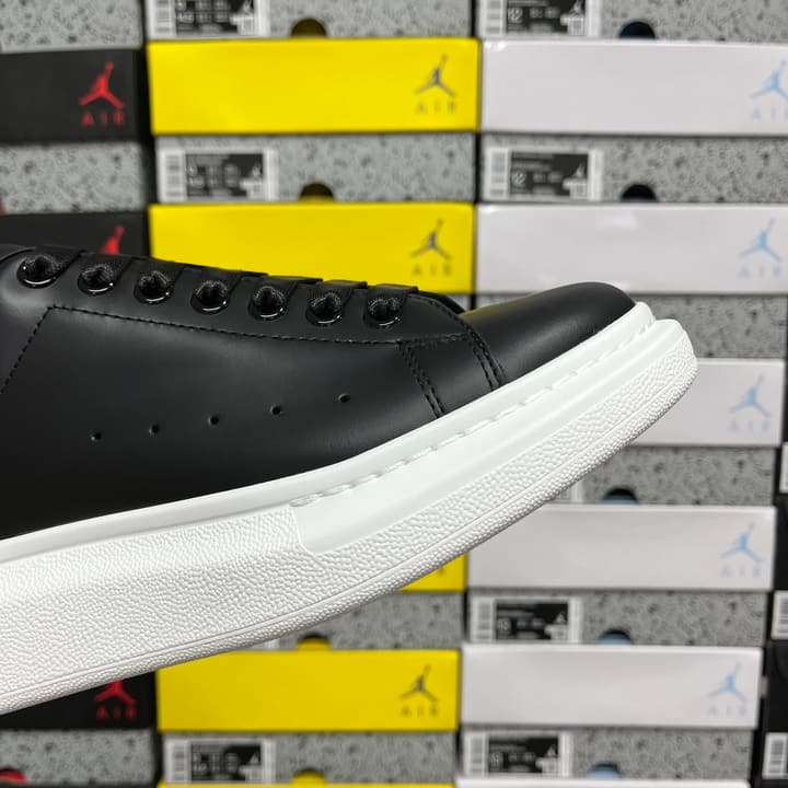 Alexander McQueen Oversized Low-Top Sneakers in All Black With White Sole
