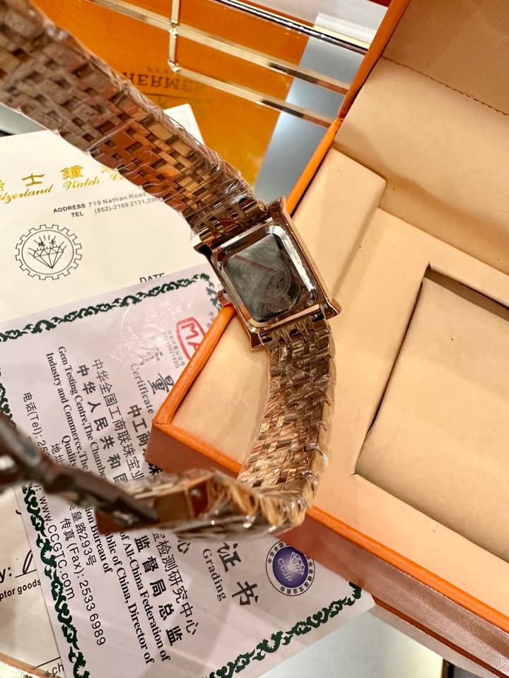 Hermès Small Square Luxury Watch in Dark Dial Patterned Gold Bracelet