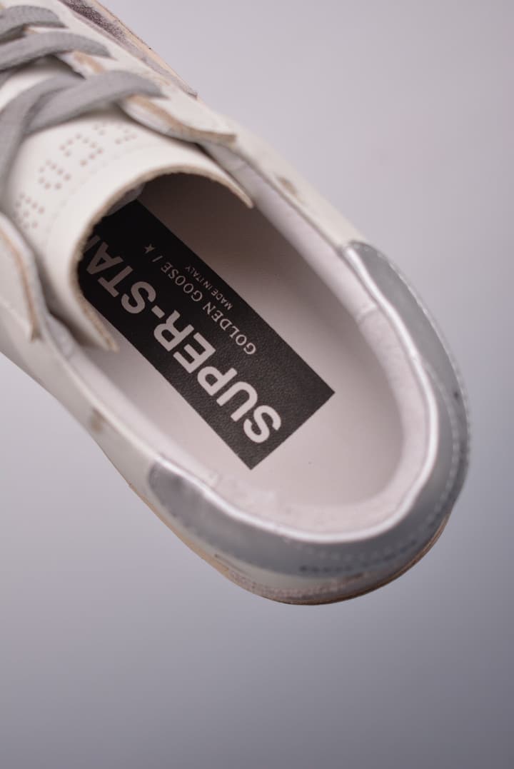 Golden Goose Super Star Distressed Sneakers – 2023 Collection in White With Navy Heel