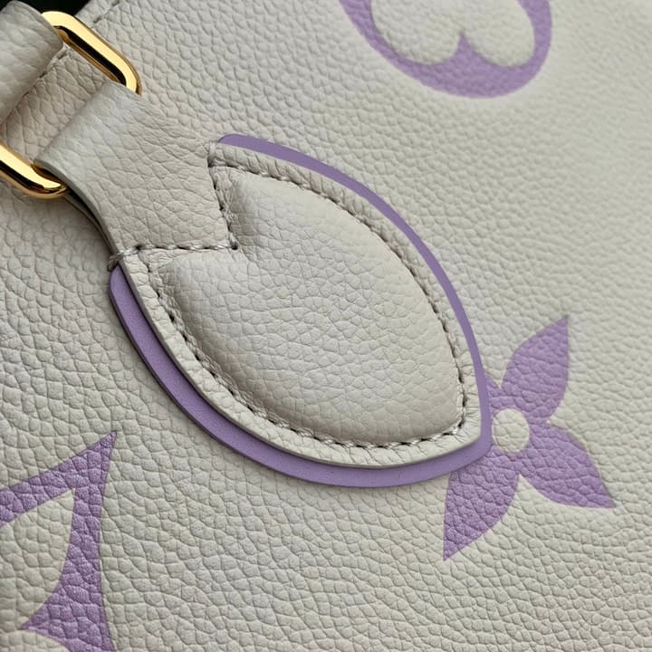 Louis Vuitton ONTHEGO Medium Tote Bag in Cream/white Monogram With Lilac Print