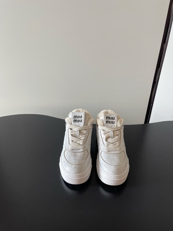 Miu Miu Distressed Retro German Training Sneakers in Distressed Off-white
