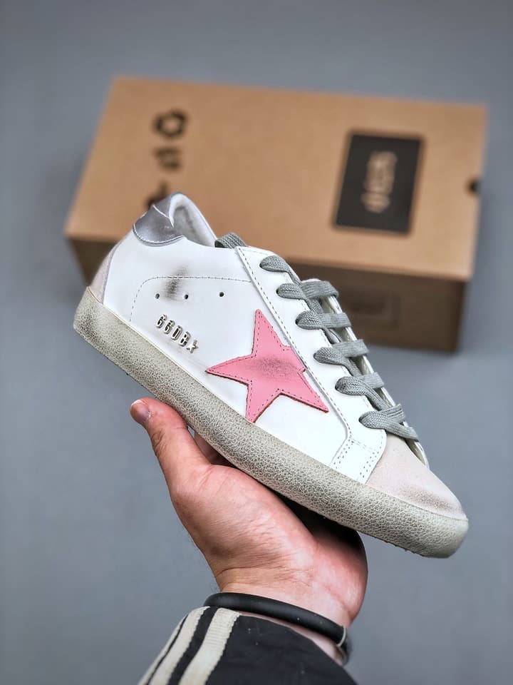 Golden Goose Distressed Sneakers in Gold