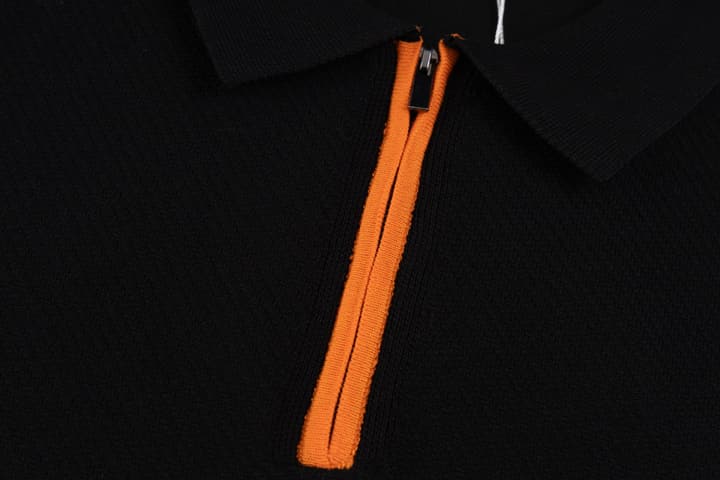 Hermès Retro Knitted Polo Shirt – SS24 in Black Polo With Orange Placket
