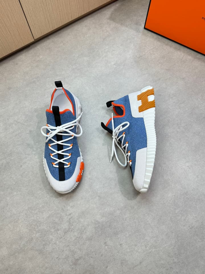 Hermès Casual Sports Sneakers in Black With White Laces And Orange Sole