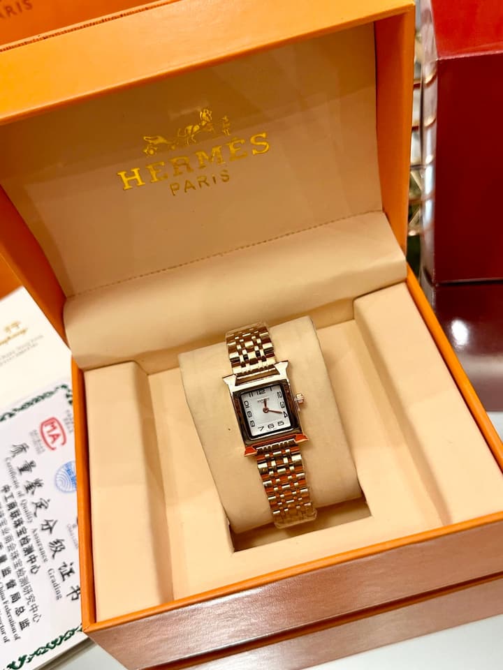 Hermès Small Square Luxury Watch in Dark Dial Patterned Gold Bracelet