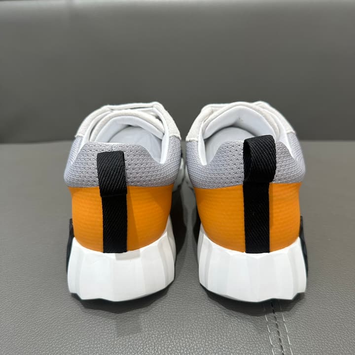 Hermès Bouncing Tech Mesh Sneakers in Black And White