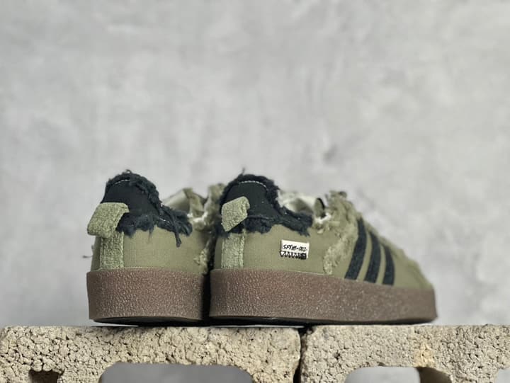 Adidas Originals x Song For The Mute Campus 80S Distressed Canvas Shell-Toe Sneakers in Distressed Olive Green 1