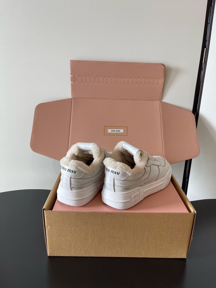 Miu Miu Distressed Retro German Training Sneakers in Distressed Off-white